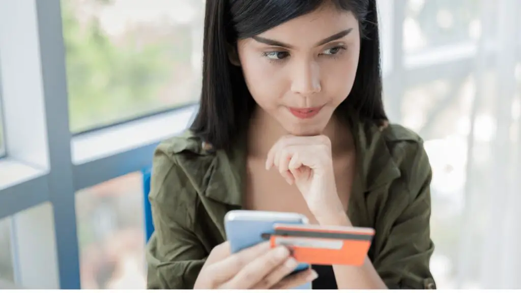 woman contemplating online purchase
