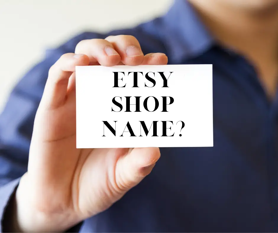 guy holding business card with "Etsy shop name?" on it