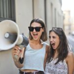 Women using megaphone